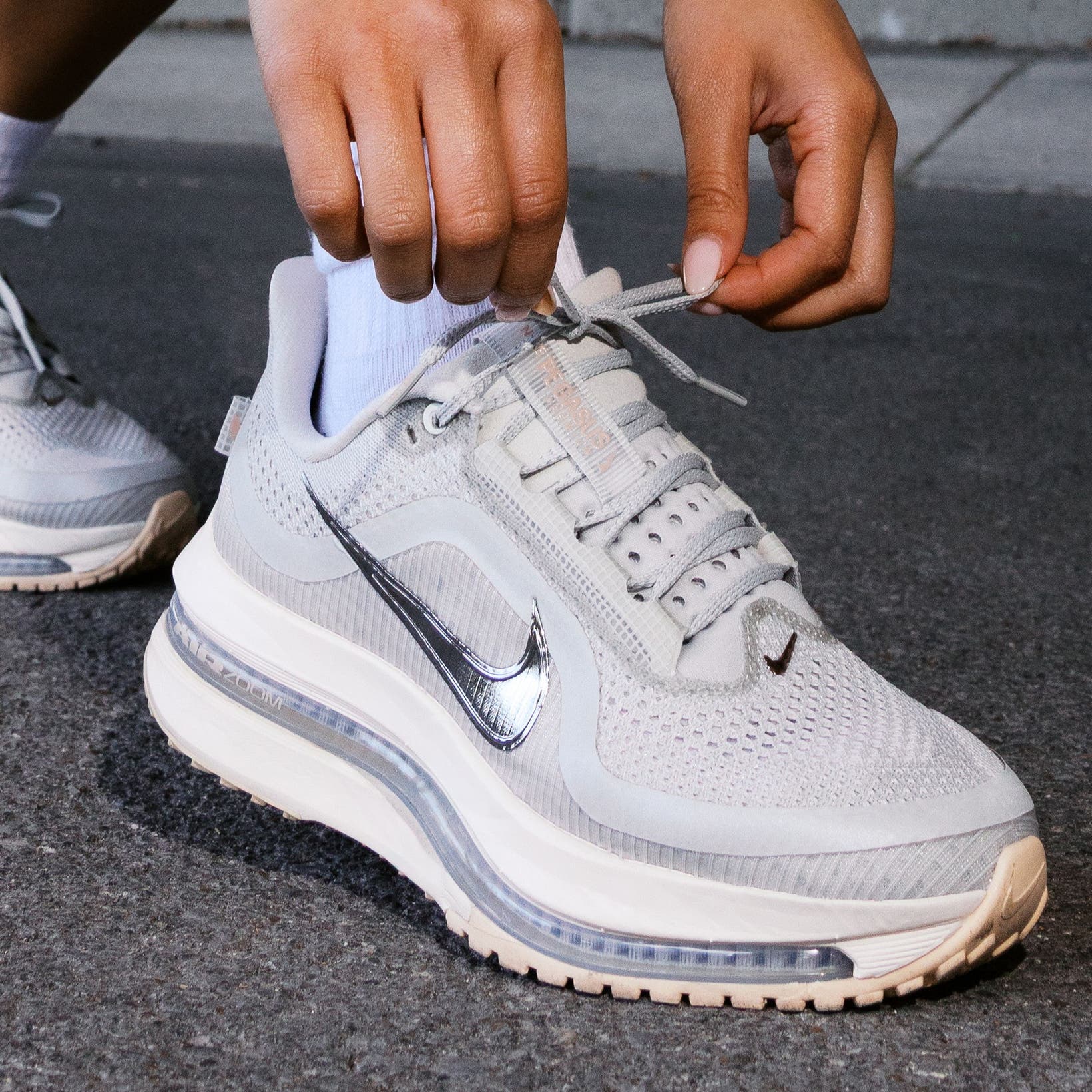 A person wearing Nike Pegasus Premium running shoes.