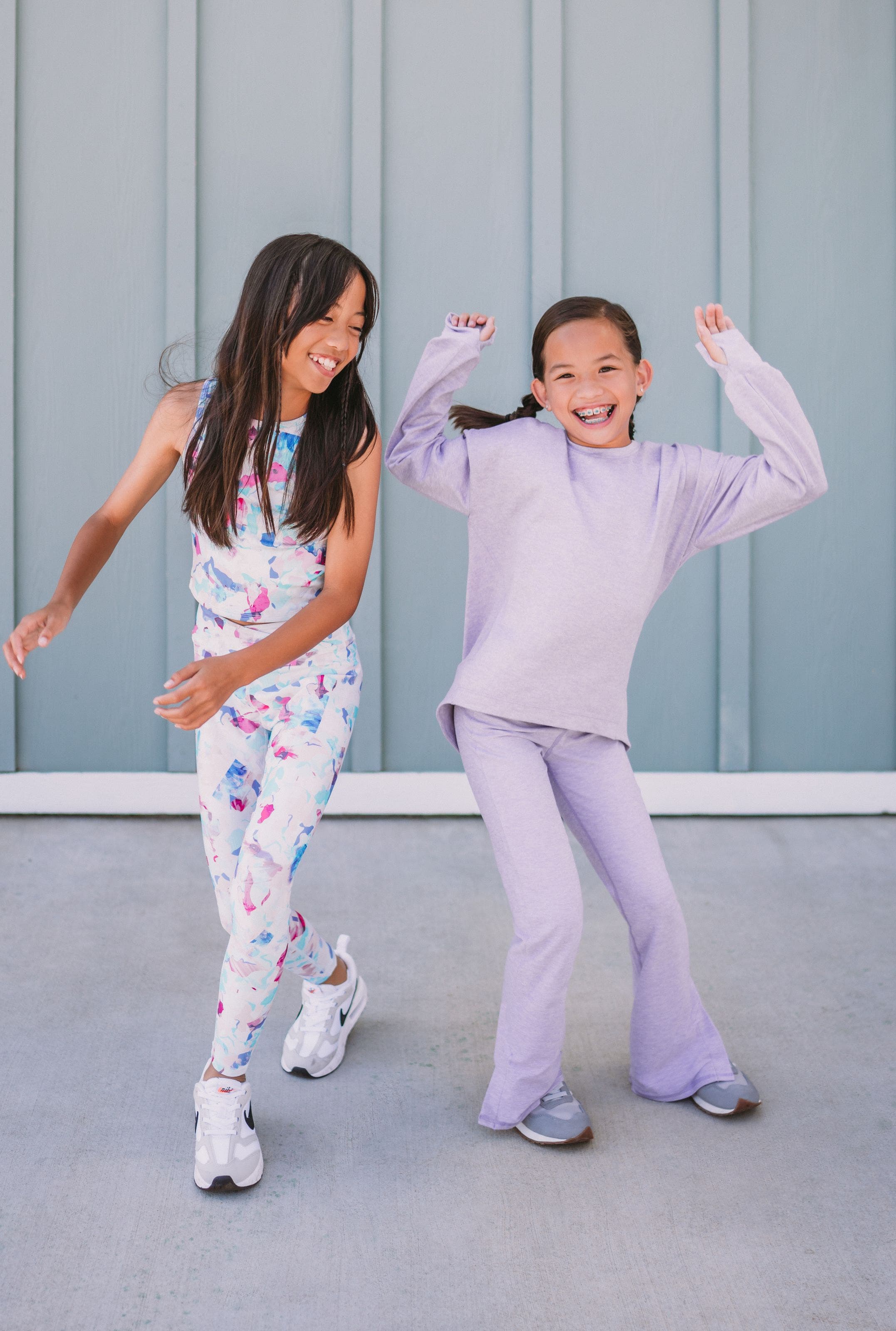 Two girls wearing Zella outfits dancing.