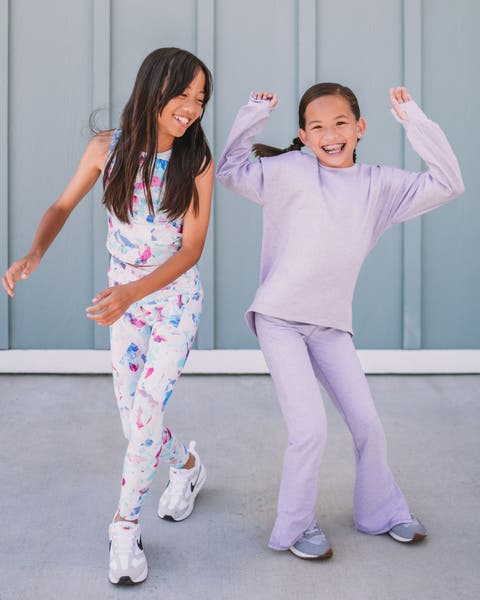 Two girls wearing Zella outfits dancing.