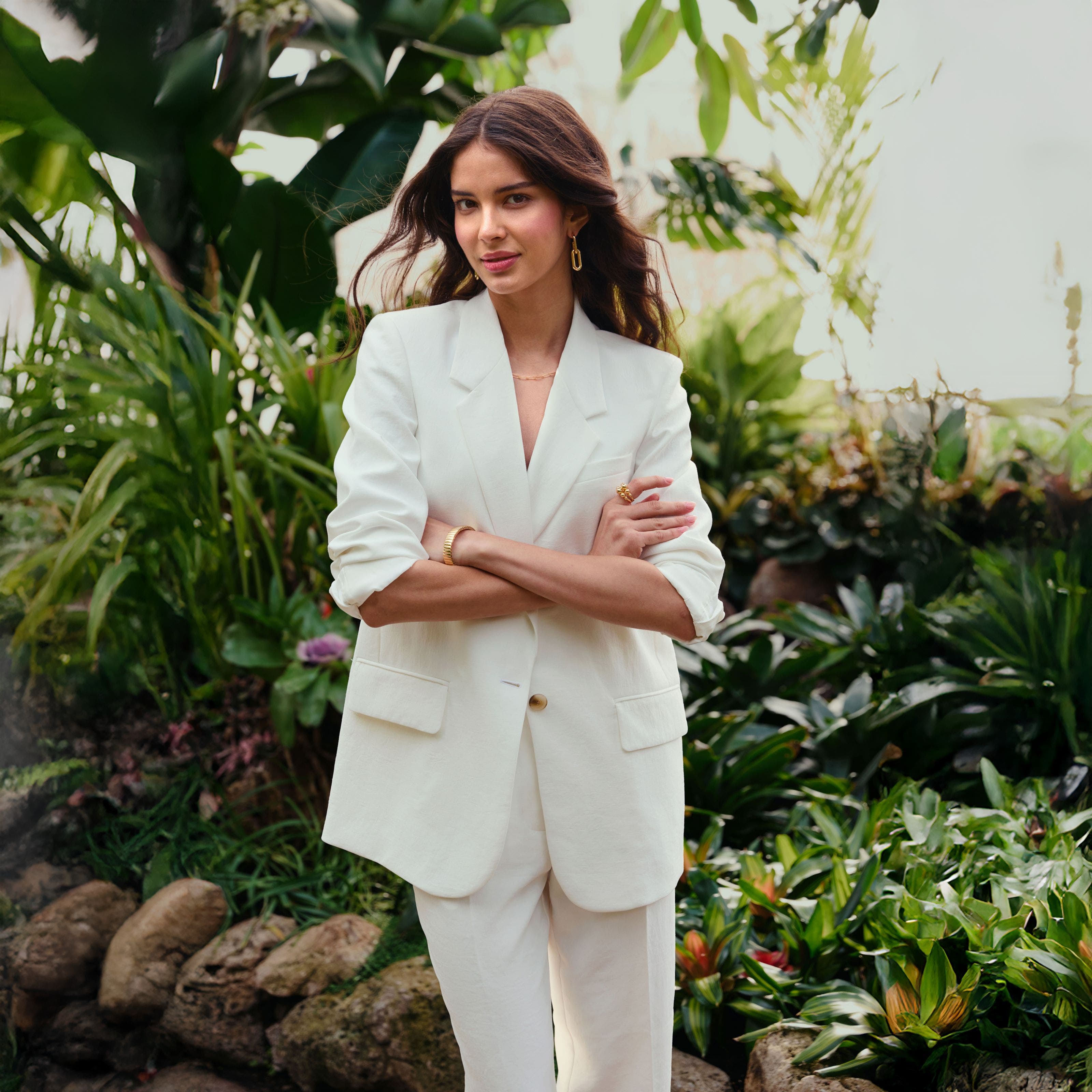 A woman in a white linen blazer.