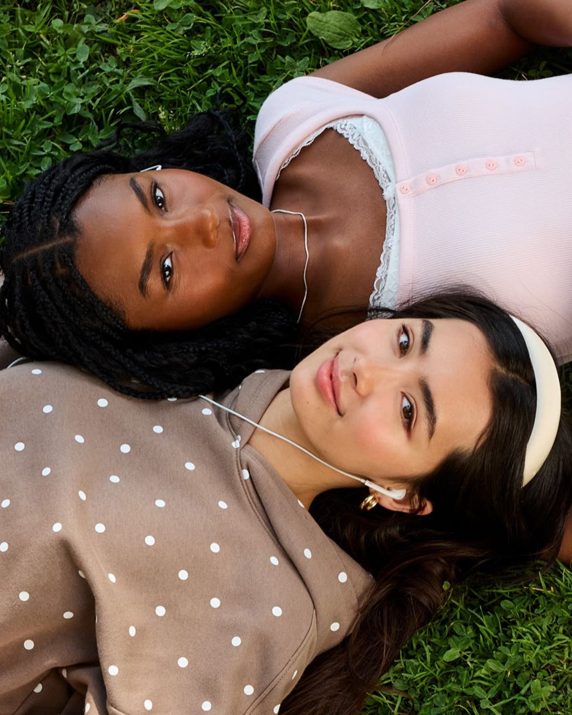 Two women wearing casual back to campus outfits.