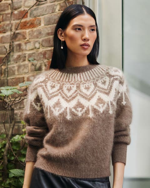 A woman in a brown Fair Isle cashmere sweater.