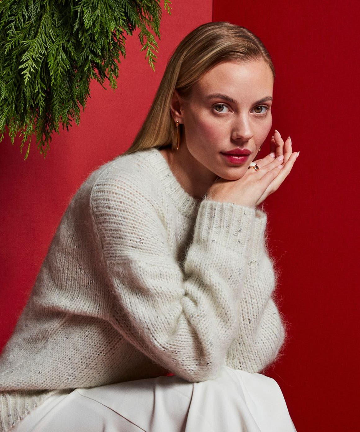 Woman wearing grey Nordstrom sweater.