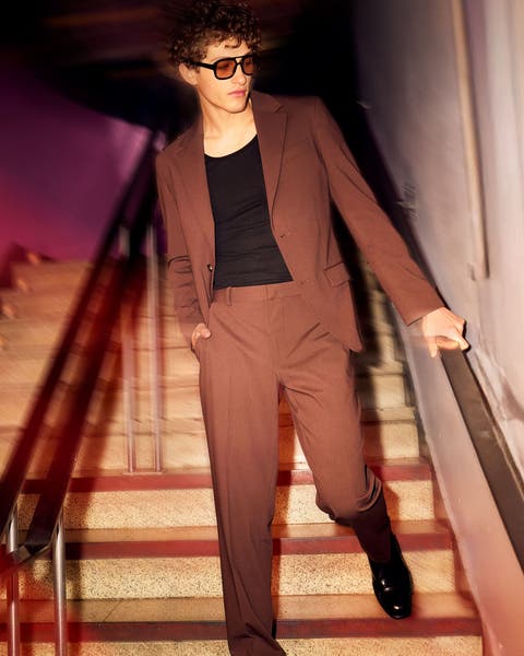 Man wearing brown Open Edit suit.