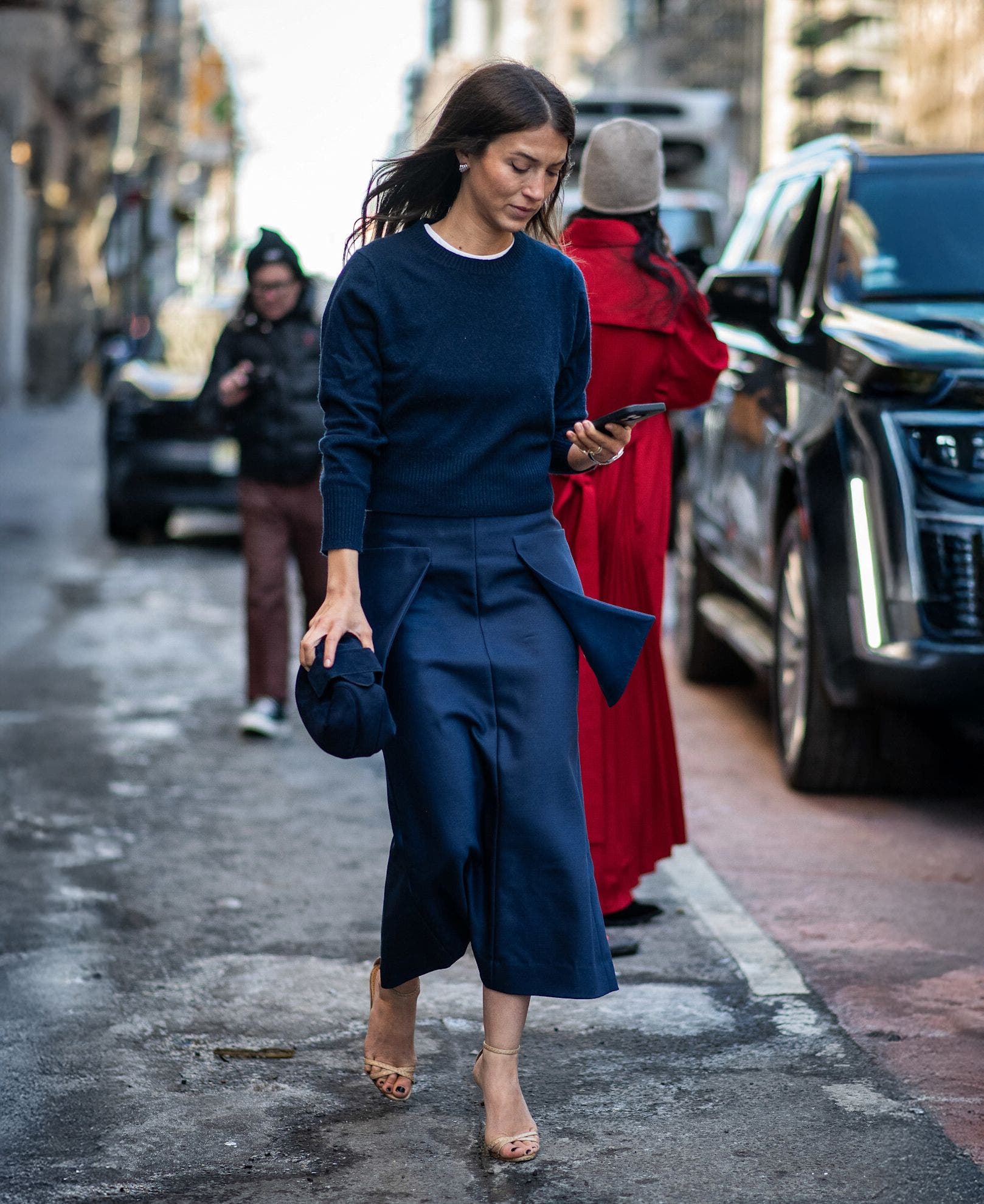 Woman in a tonal blue outfit at New York Fashion Week.