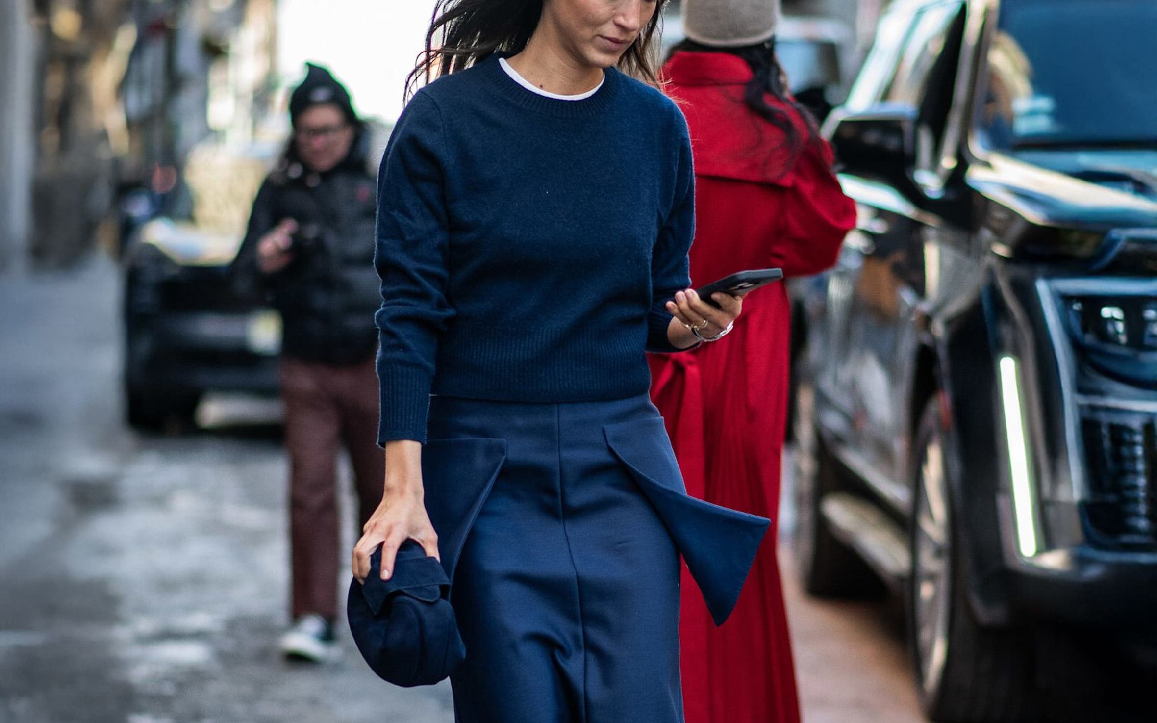 Woman in a tonal blue outfit at New York Fashion Week.