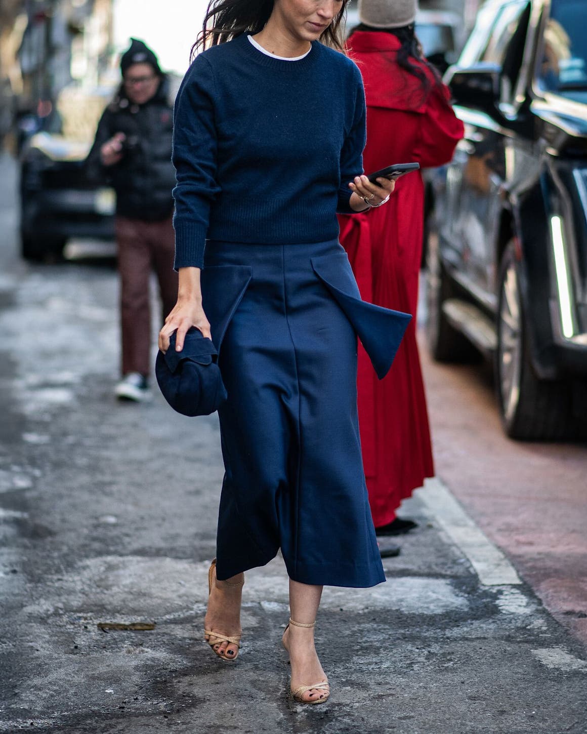 Woman in a tonal blue outfit at New York Fashion Week.