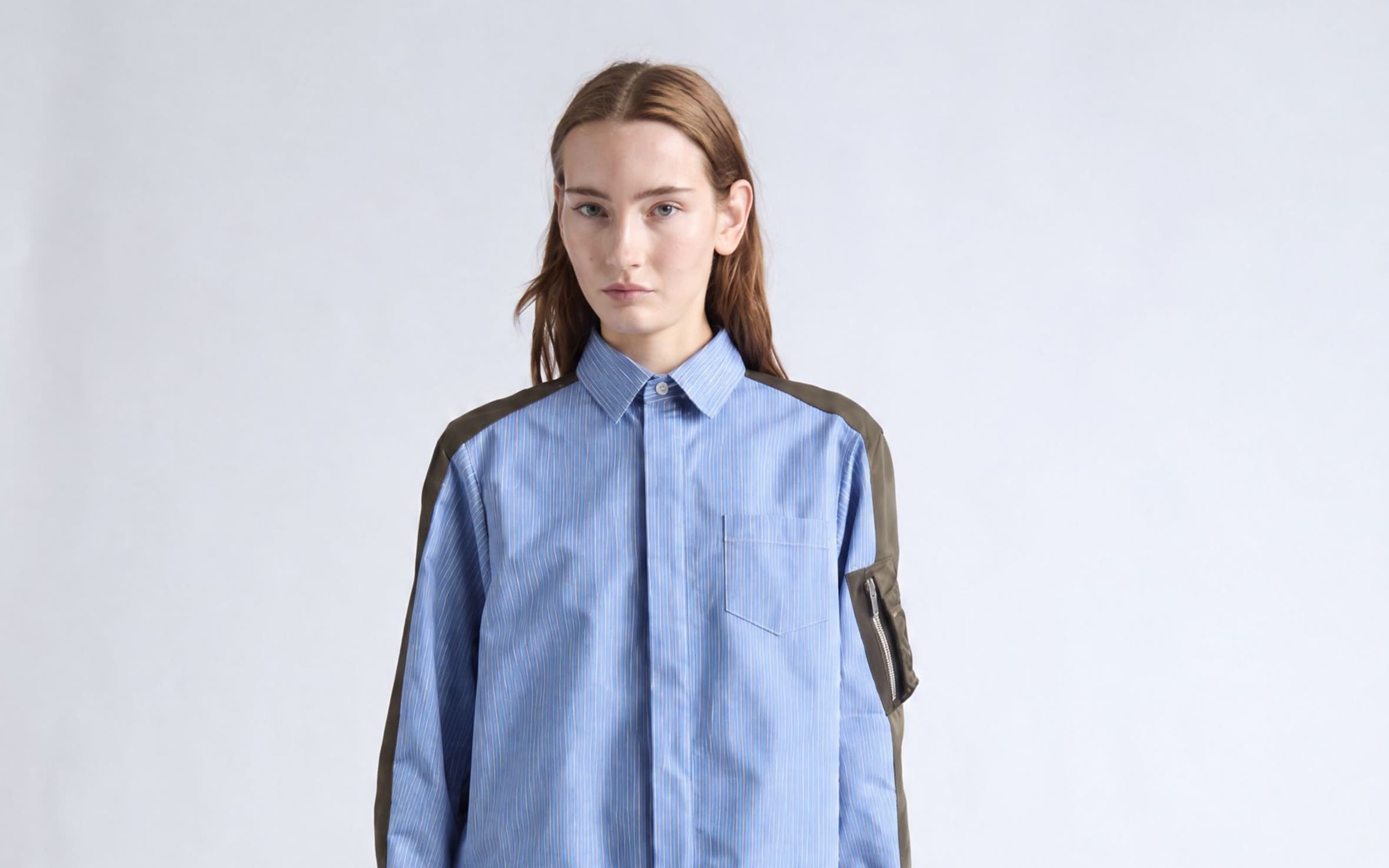 Women in SACAI blouse and trousers.