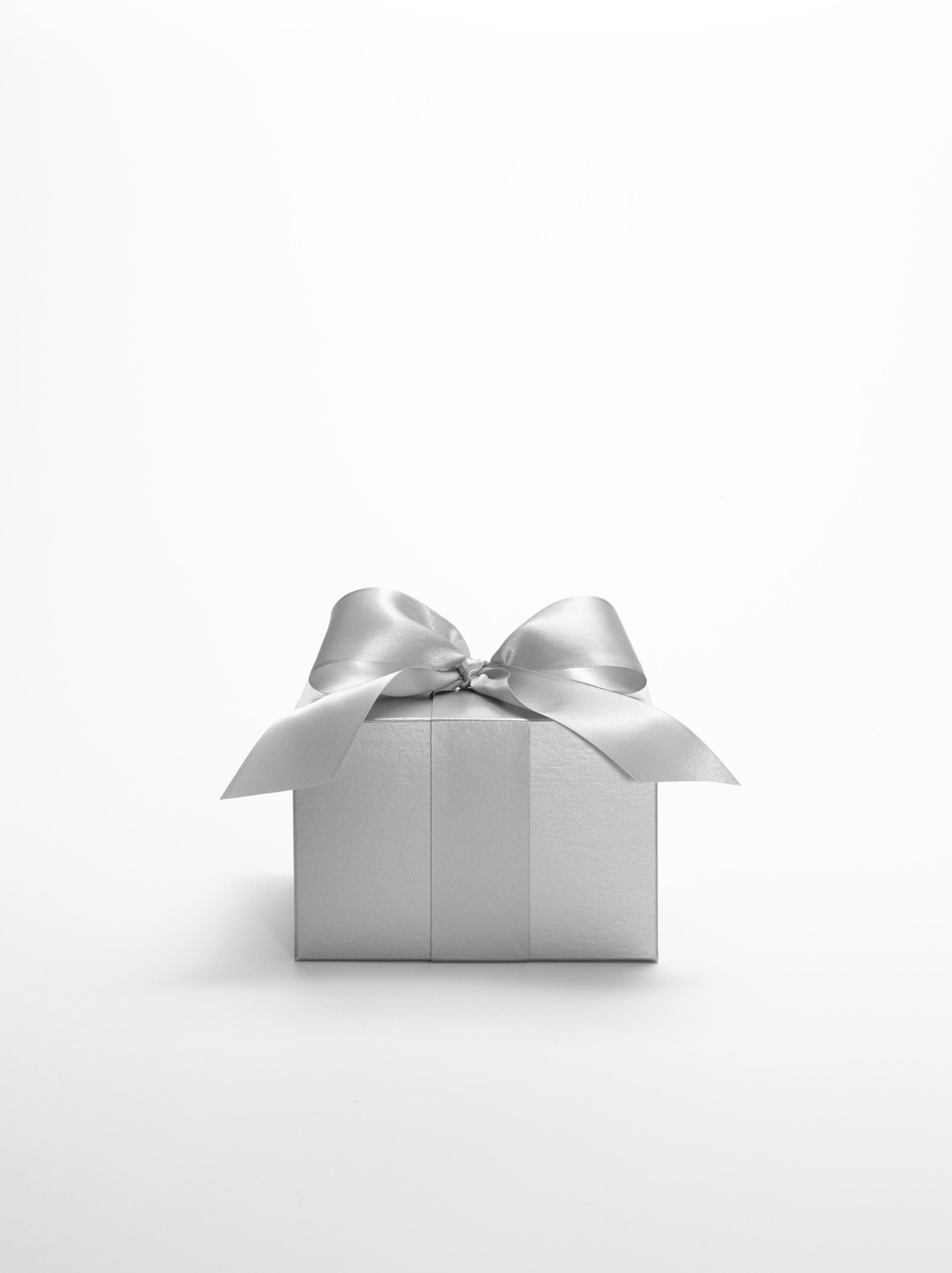 A silver Nordstrom gift box tied with a silver ribbon.