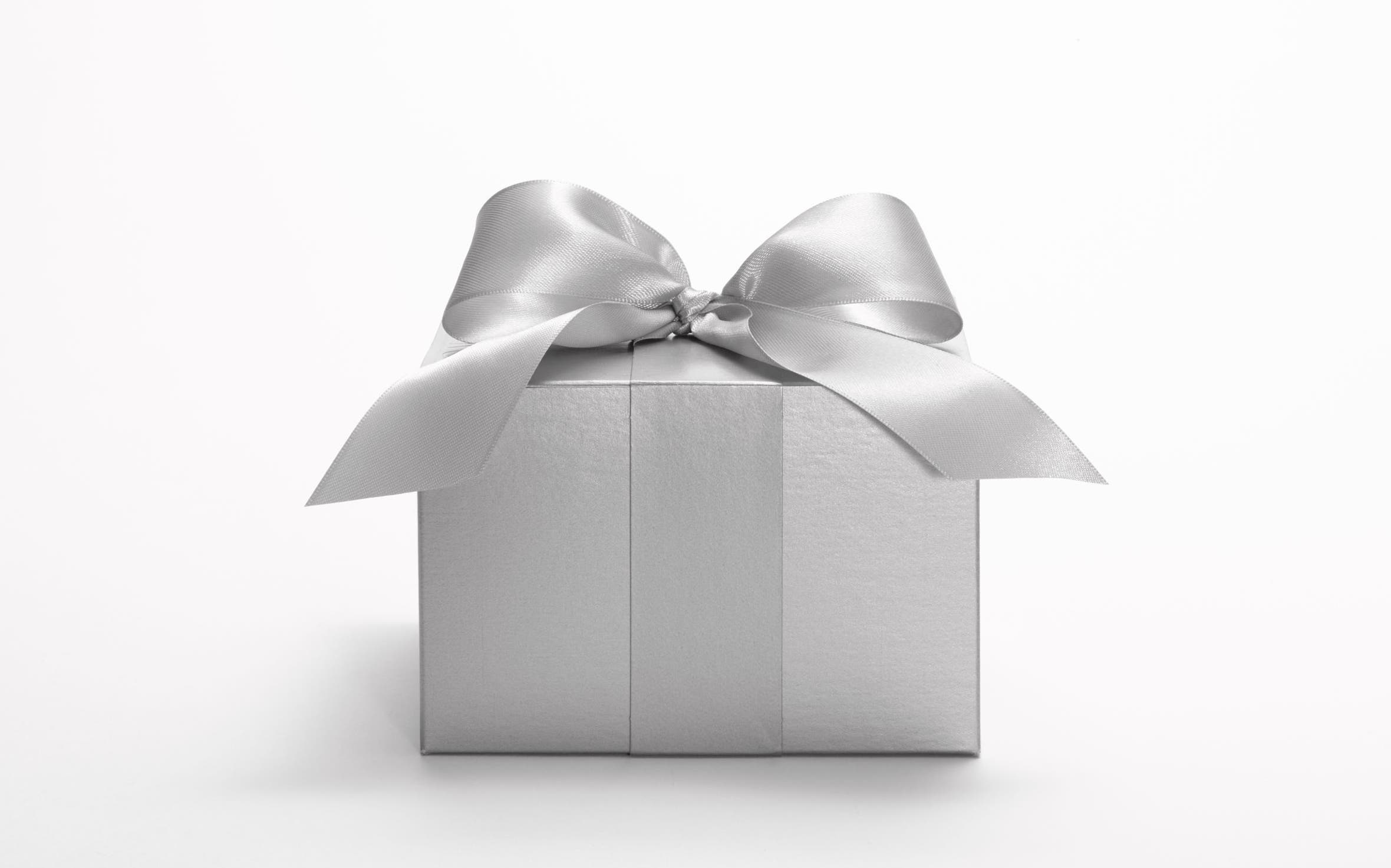 A silver Nordstrom gift box tied with a silver ribbon.