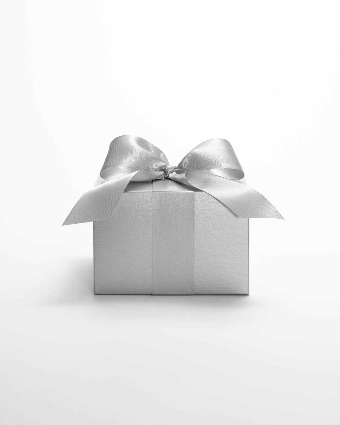 A silver Nordstrom gift box tied with a silver ribbon.