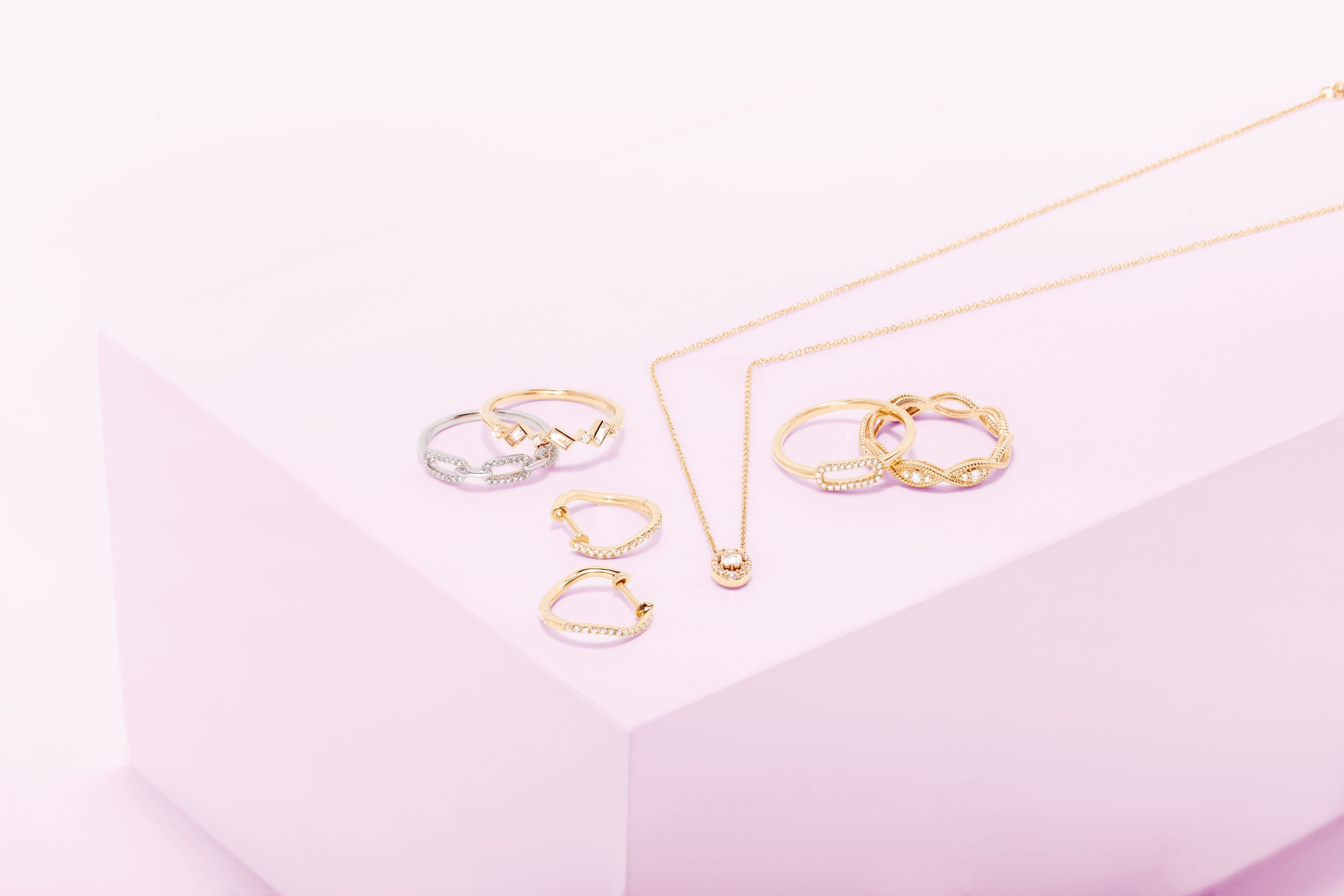 Several gold rings, earrings, and necklace. 