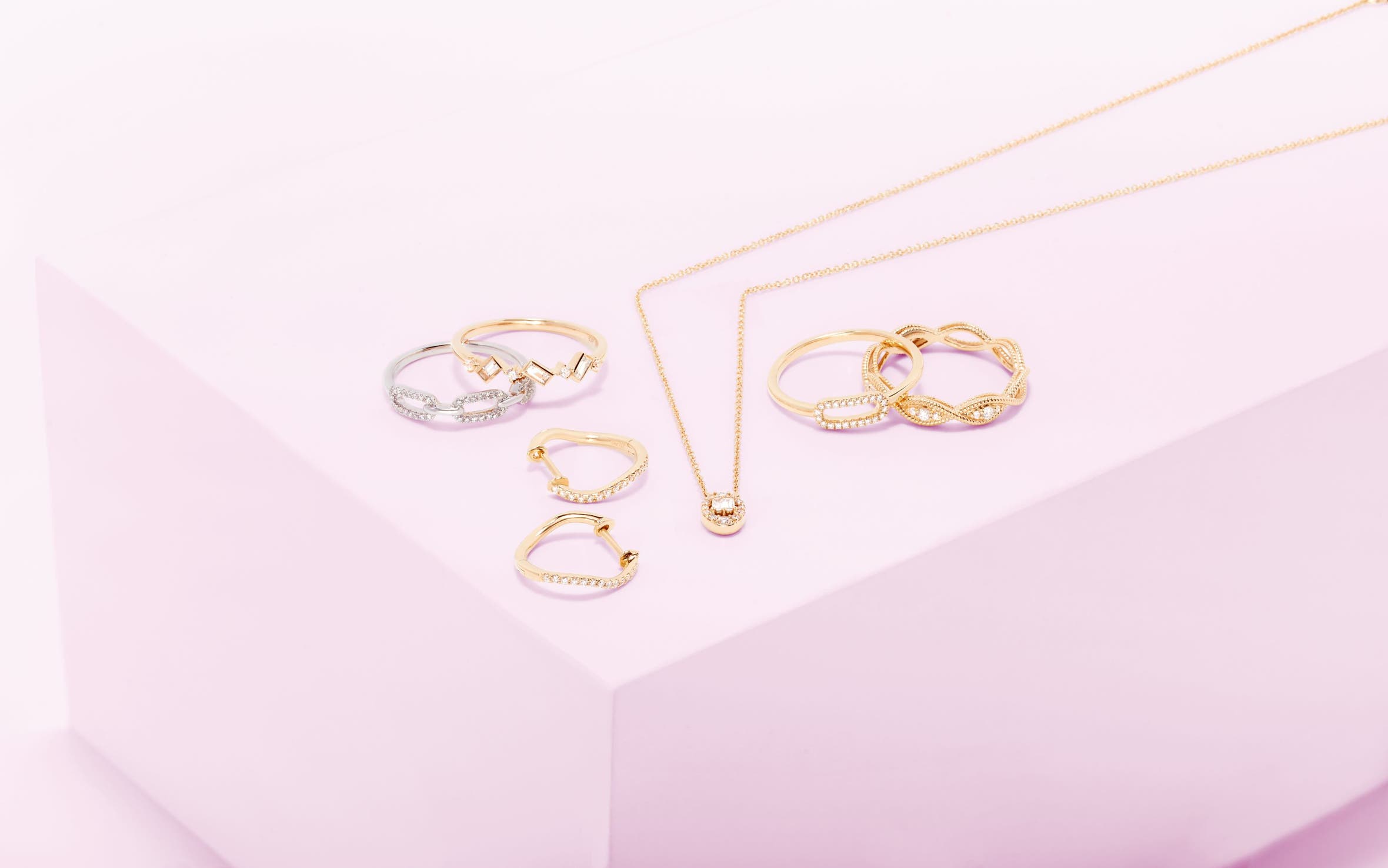 Several gold rings, earrings, and necklace.