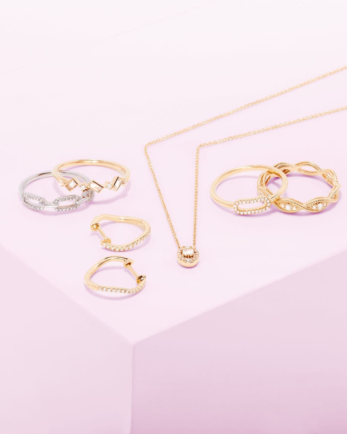 Several gold rings, earrings, and necklace.