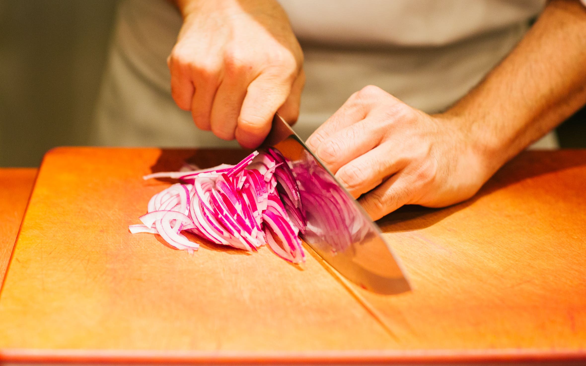 Chef slicing onions