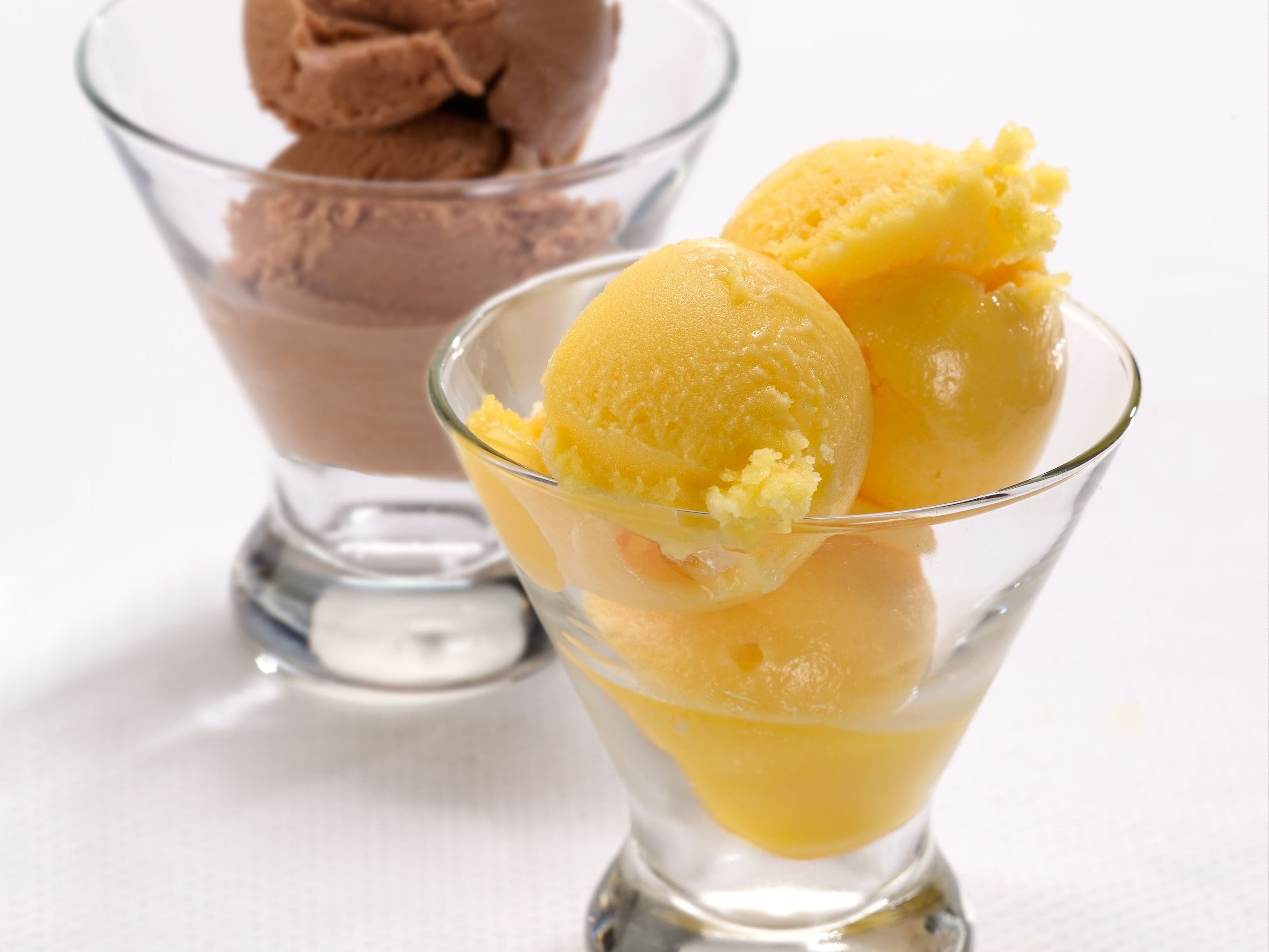 Two coupe glasses filled with gelato.