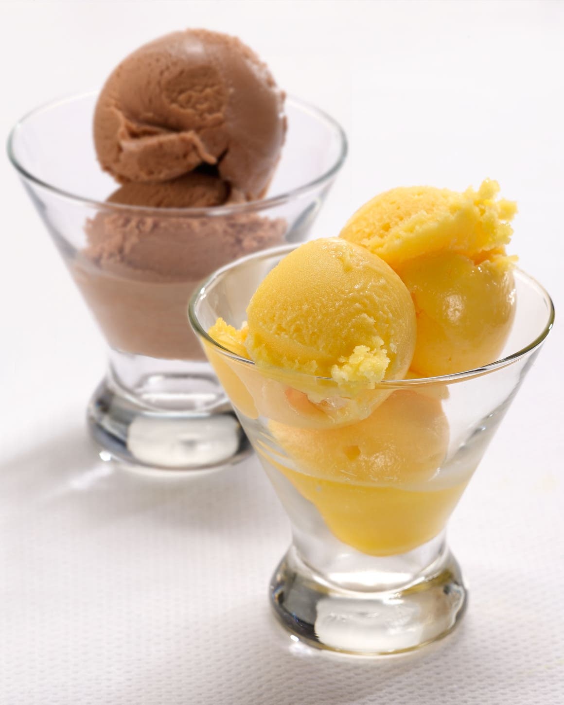 Two coupe glasses filled with gelato.