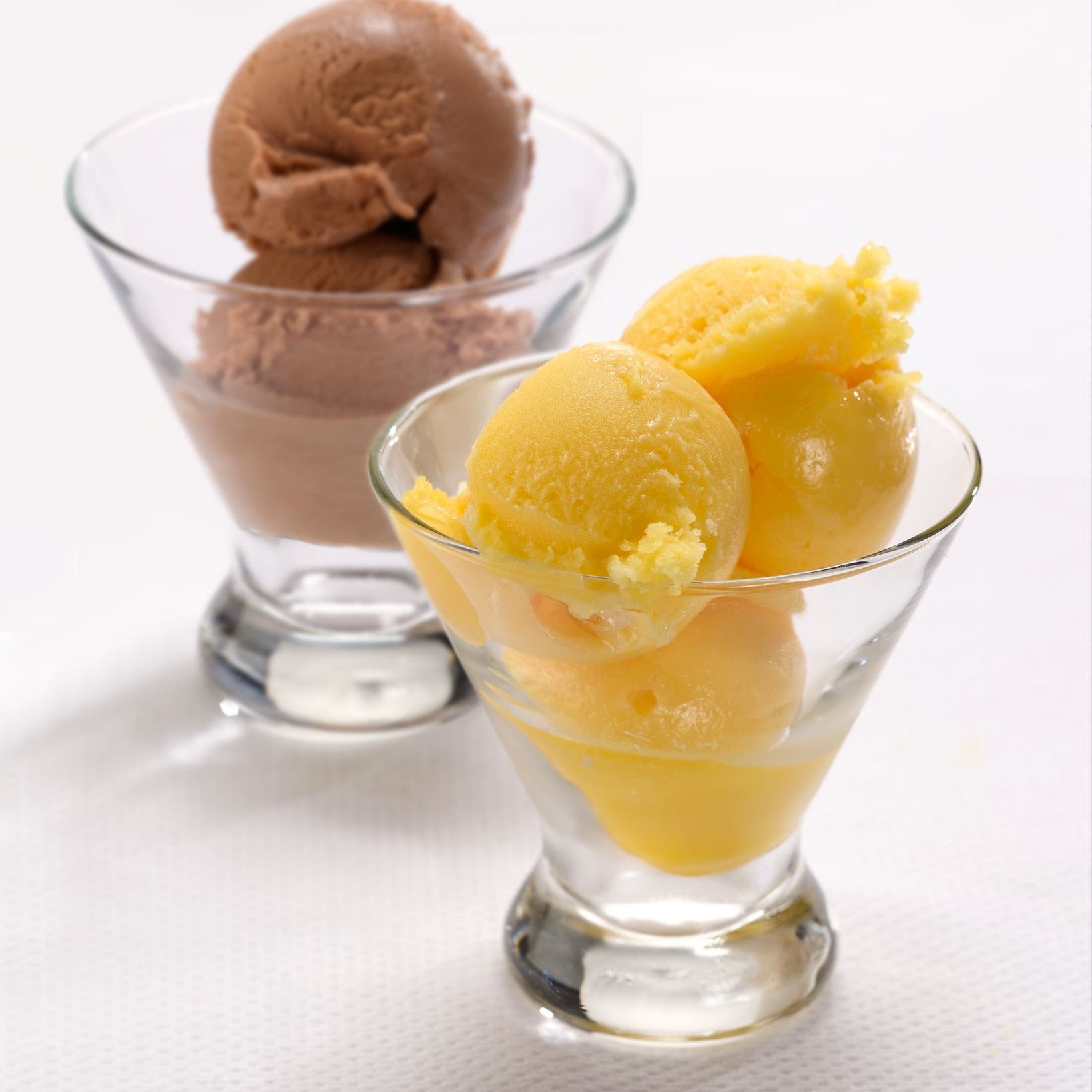 Two coupe glasses filled with gelato.