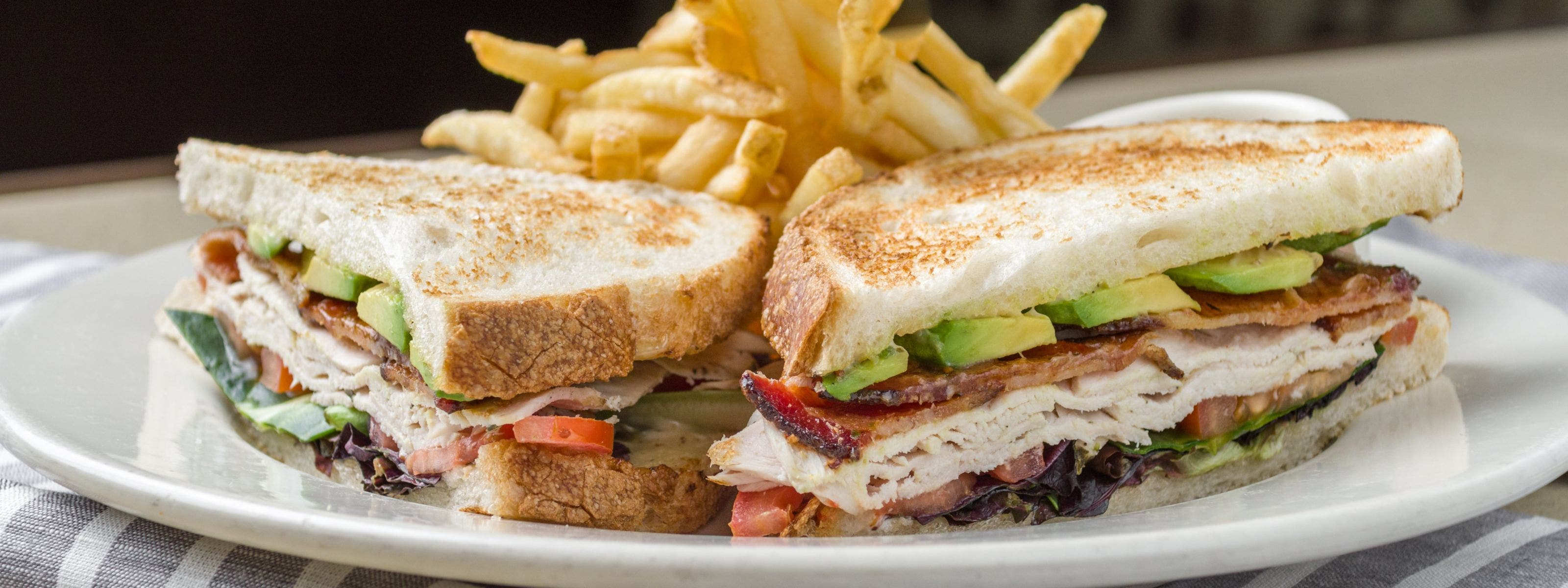 Cafe Bistro Turkey Avocado Club Sandwich.