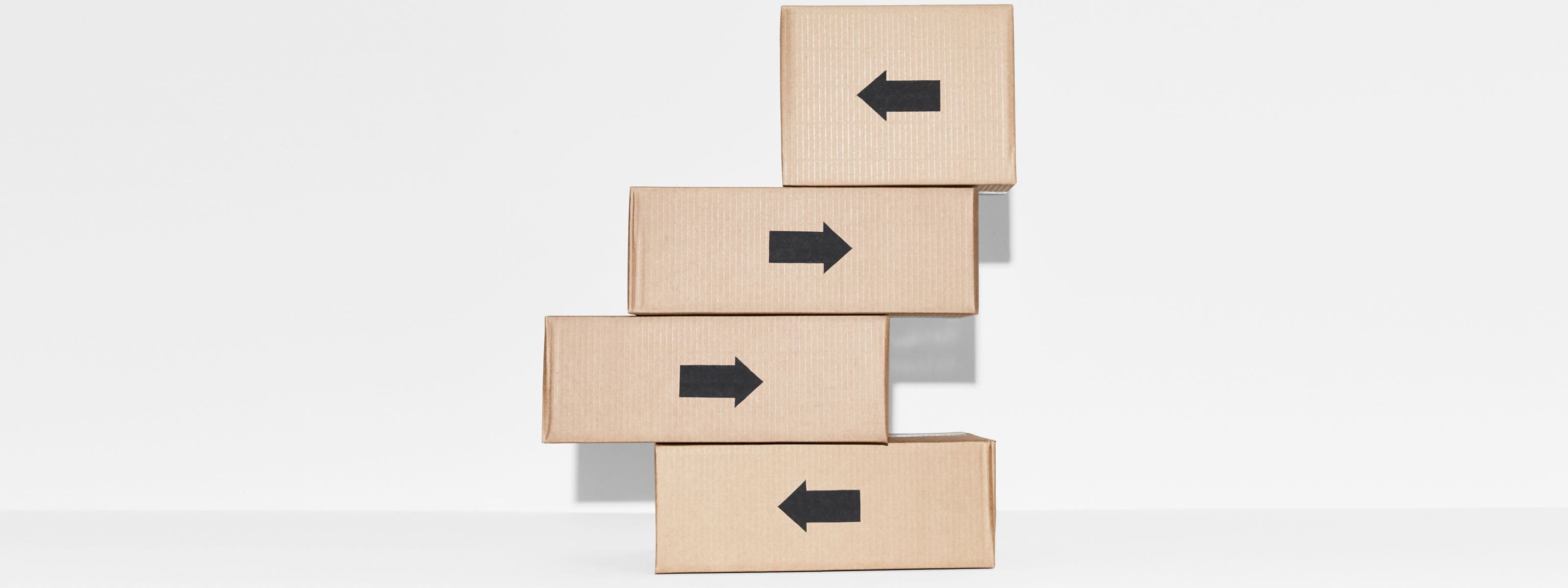 A stack of four Nordstrom shipping boxes.