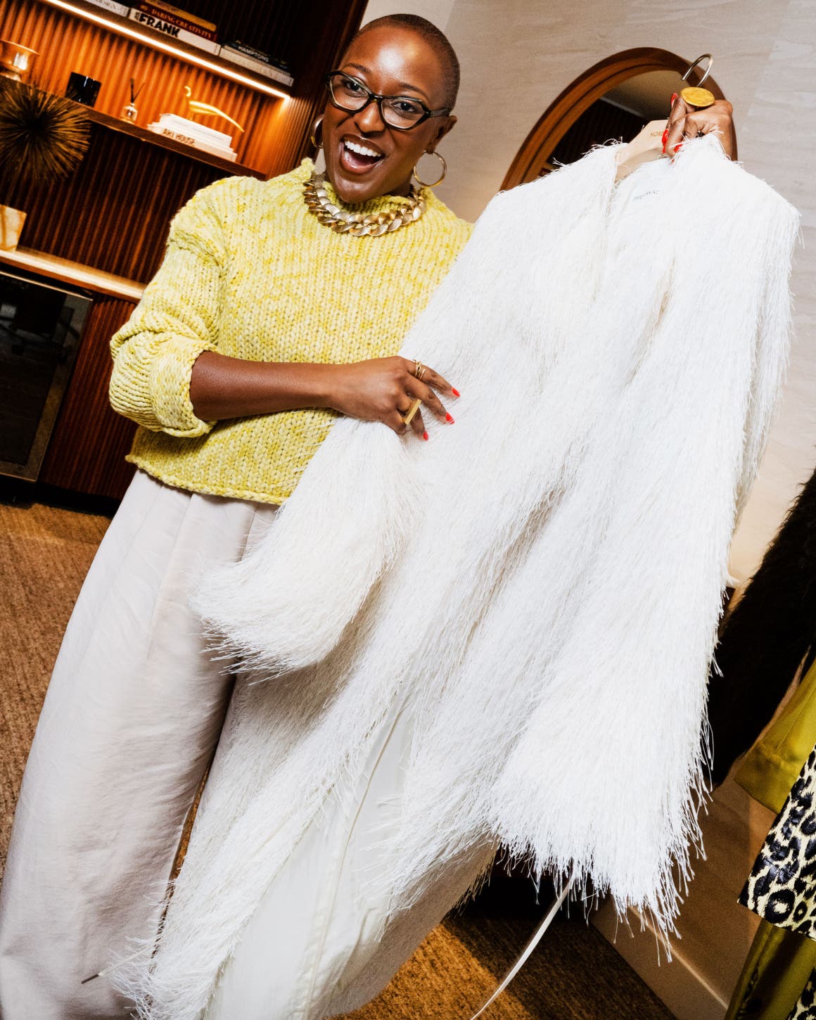 Stylist holding a jacket.
