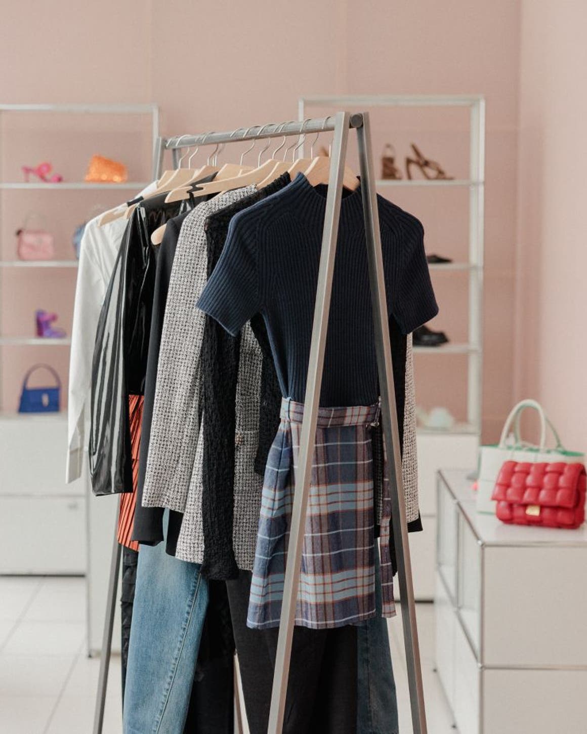 Racks of clothes, shoes and accessories.