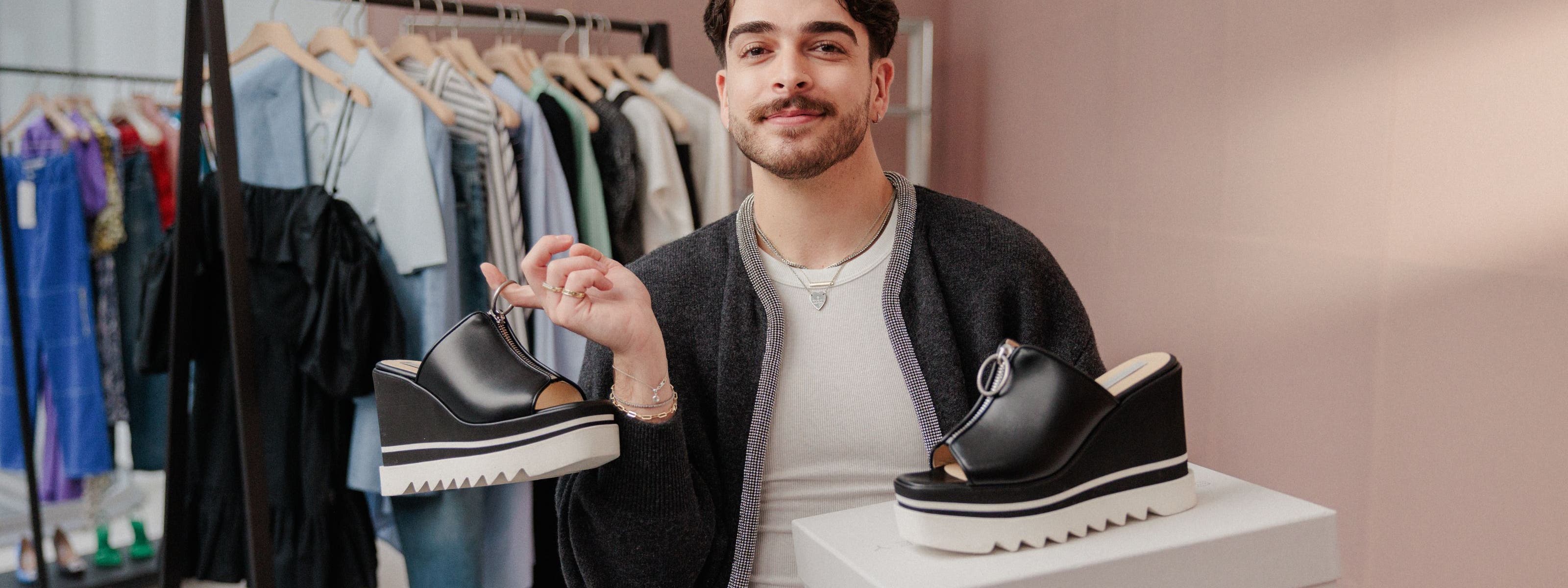 Nordstrom salesperson with a pair of shoes in two different sizes.
