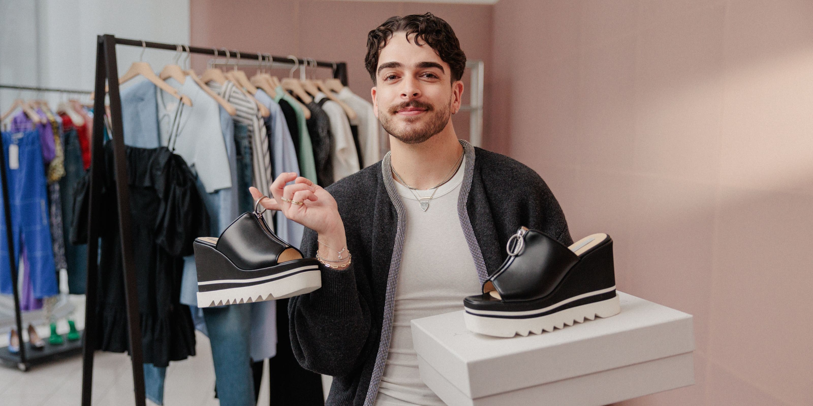 Nordstrom salesperson with a pair of shoes in two different sizes.