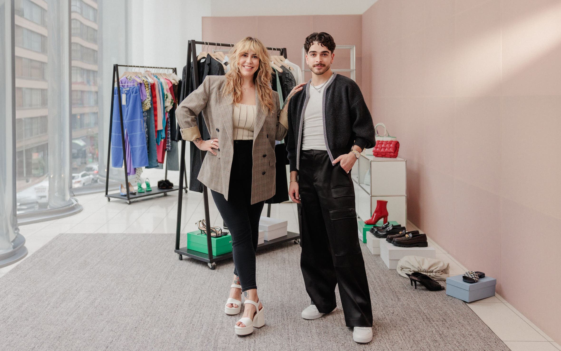 Nordstrom stylists with racks of clothes. 