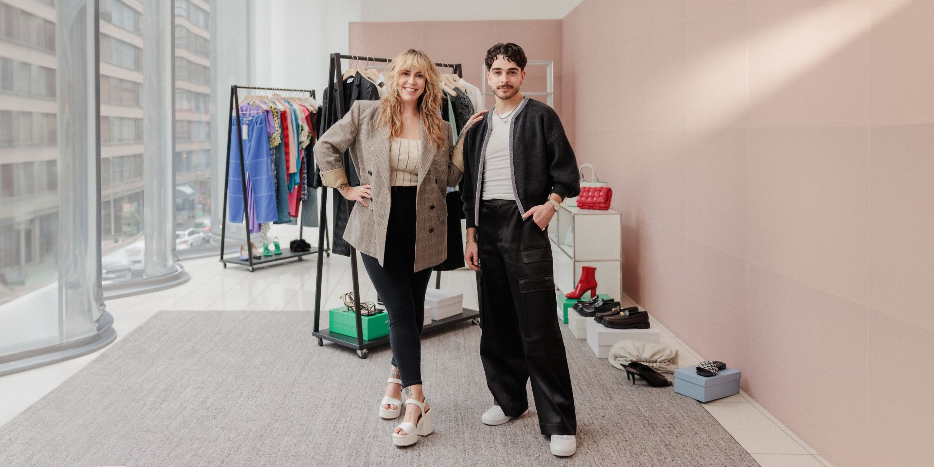 Two Nordstrom stylists in front of racks of clothing, shoes and accessories.