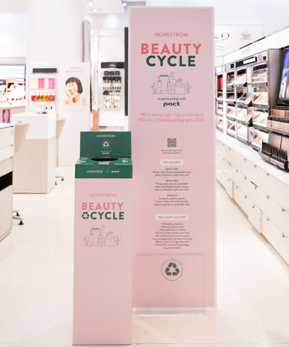 A BEAUTYCYCLE box for empty beauty and fragrance containers in a Nordstrom beauty department.