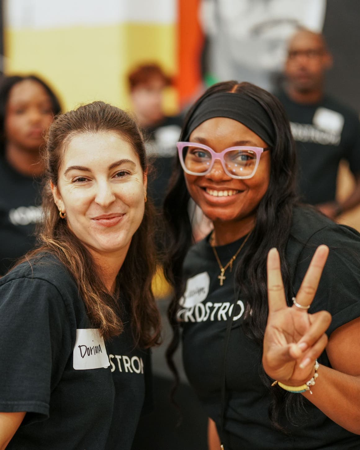 Two volunteers at a Shoes That Fit event.