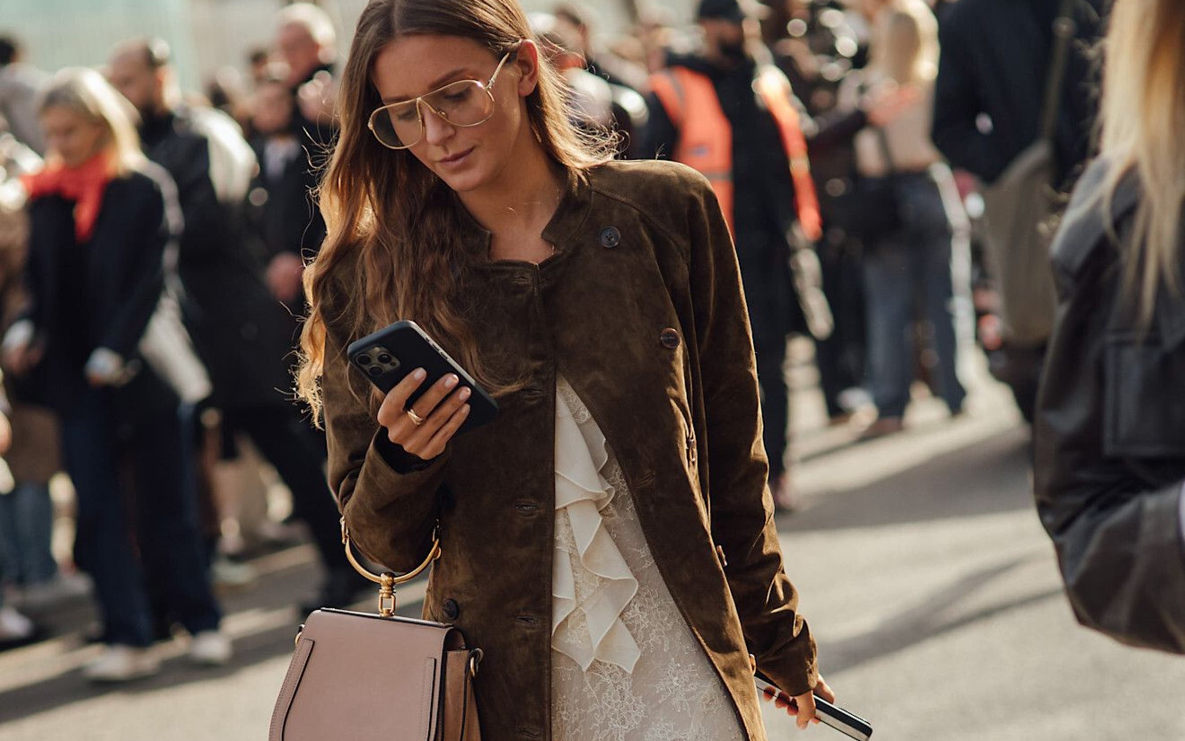 Woman wearing a lace dress at Paris Fashion Week.