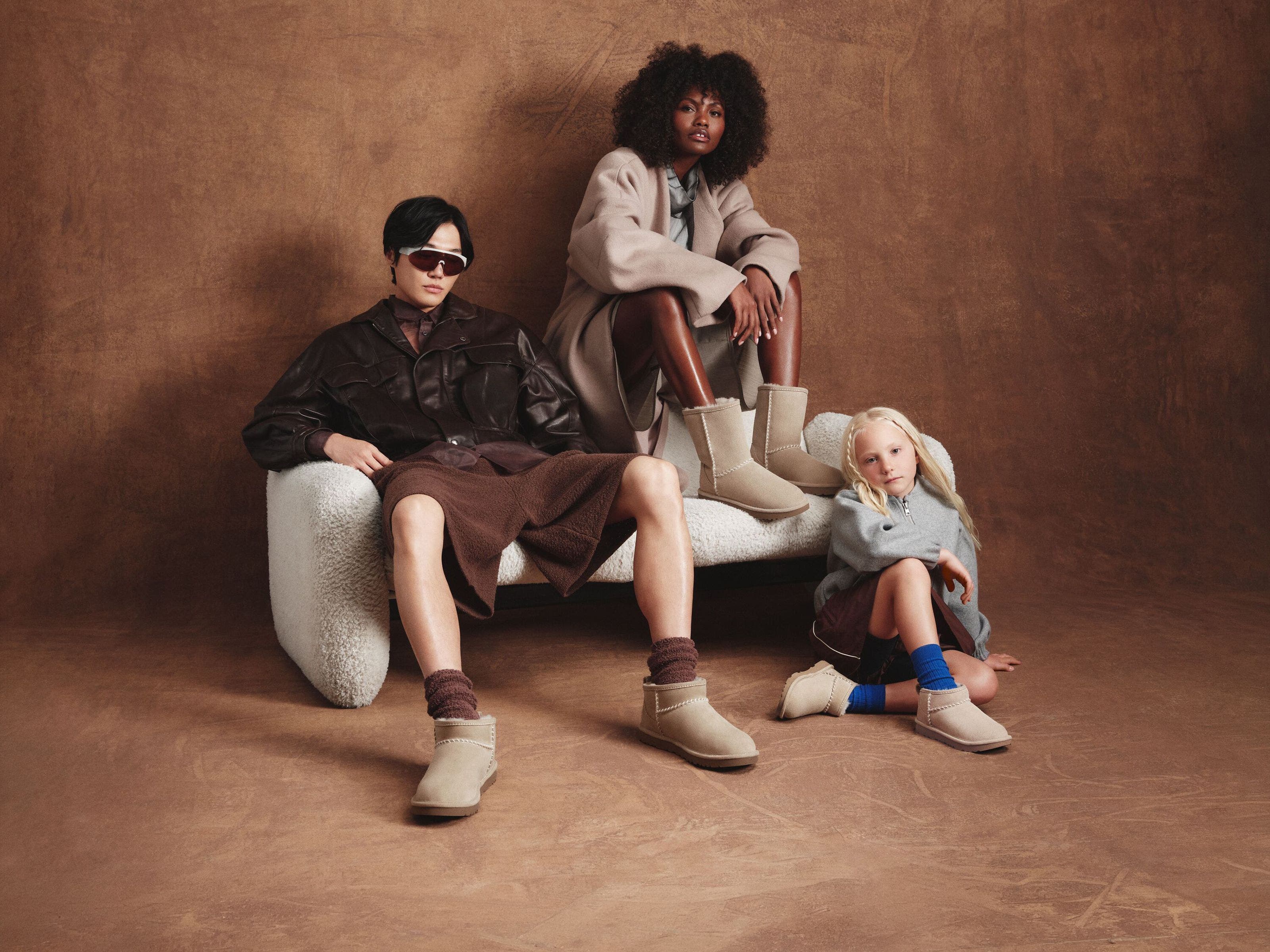 Two adults and a child wearing Nordstrom-exclusive UGG boots. 