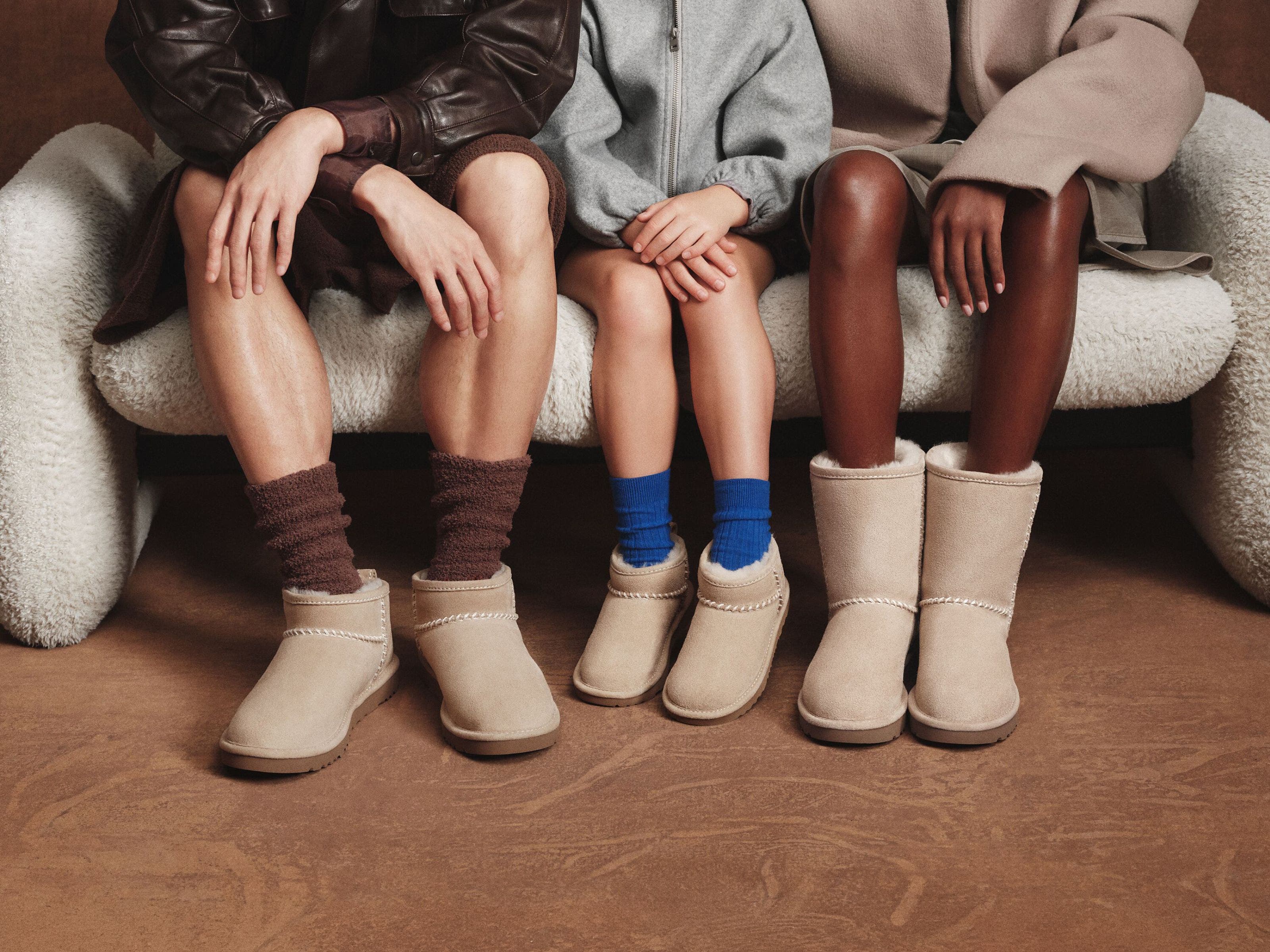 Two adults and a child wearing Nordstrom-exclusive UGG boots. 