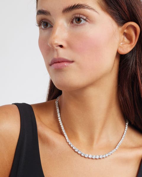 Model wearing a diamond necklace.