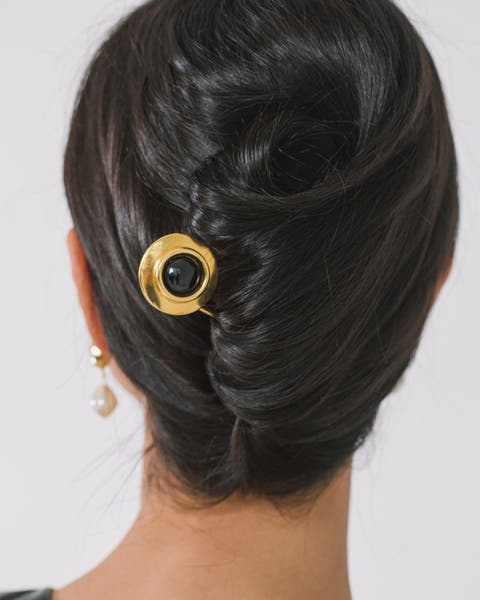 A gold hair pin.