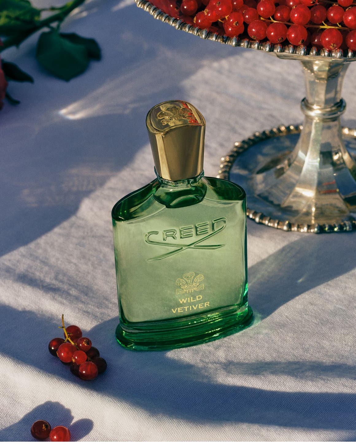A bottle of Creed Wild Vetiver fragrance.