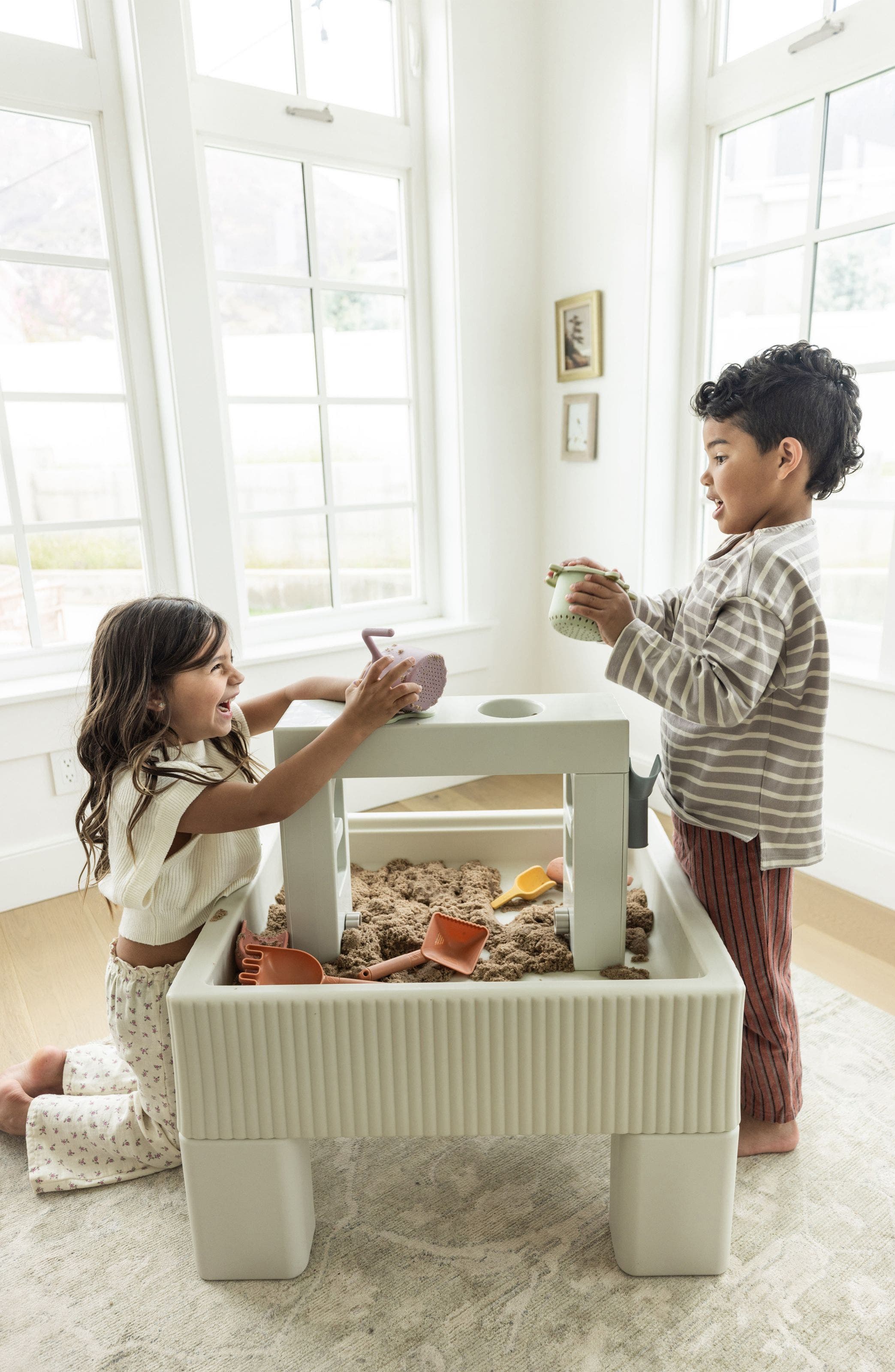 kids playing with a sandbox