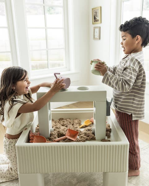 kids playing with a sandbox