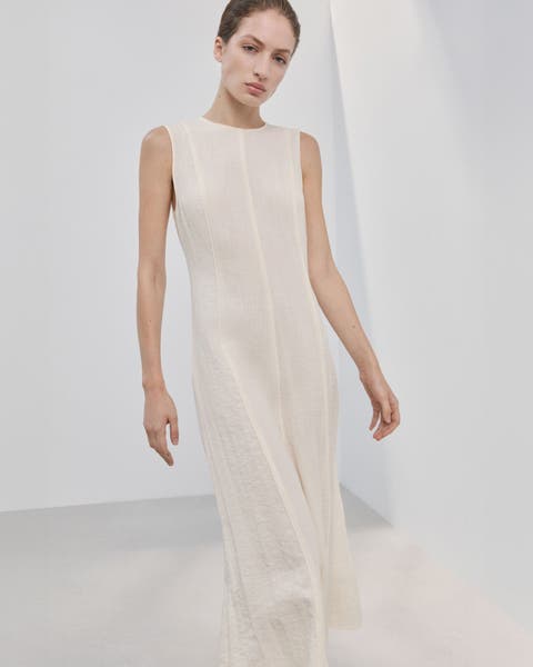 A woman wearing an A-line dress.