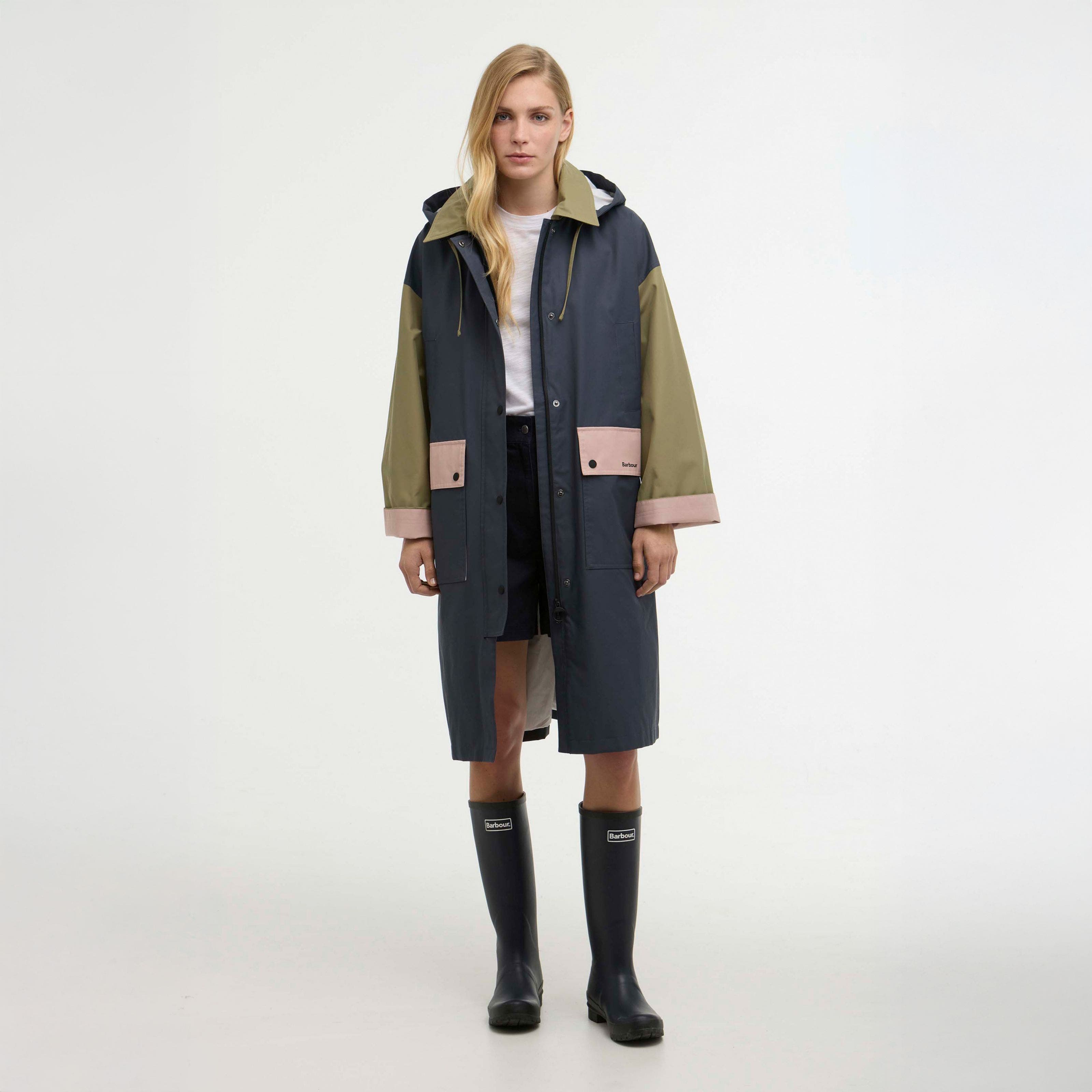 A woman wearing a colorblock rain jacket.