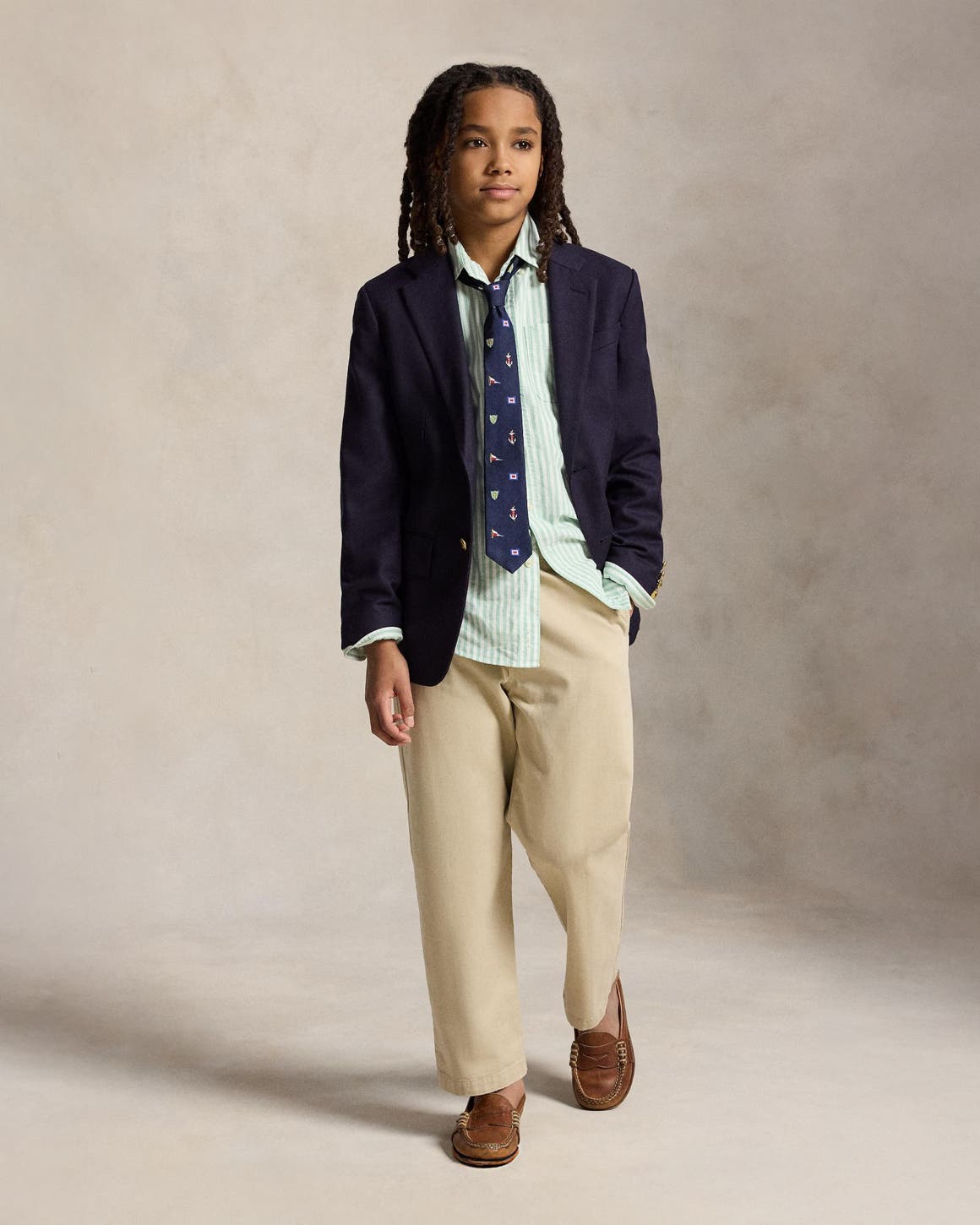A boy wearing an Easter outfit from Polo Ralph Lauren.