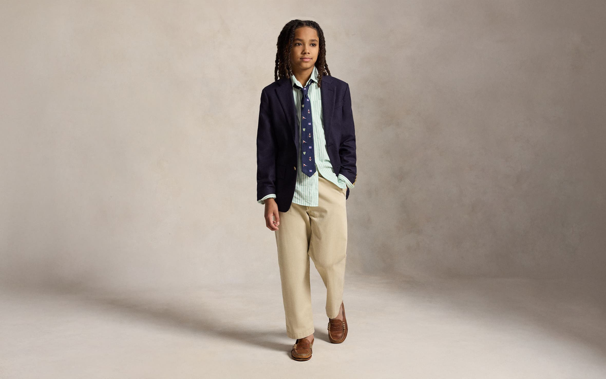 A boy wearing an Easter outfit from Polo Ralph Lauren.