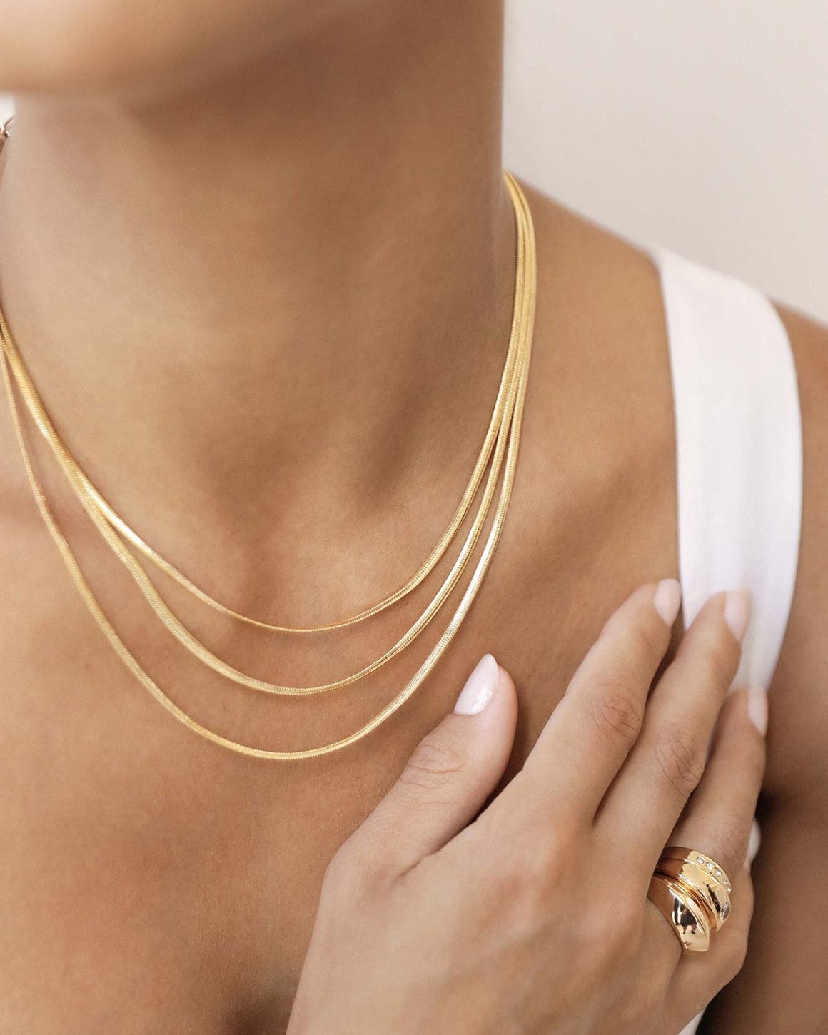 Woman wearing Ettika jewelry.