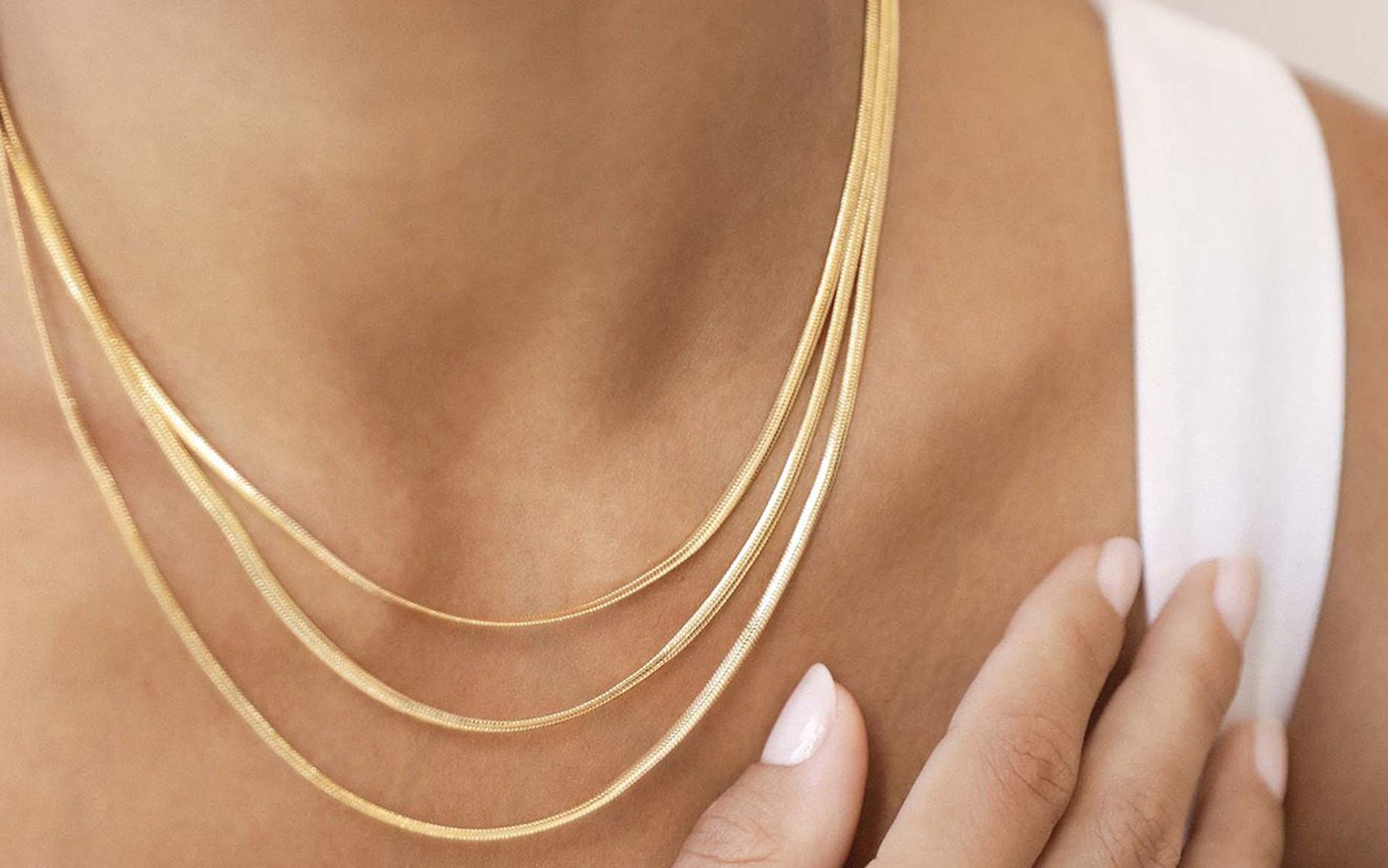 Woman wearing Ettika jewelry.