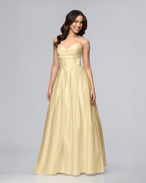 women wearing yellow long a-line prom dress.