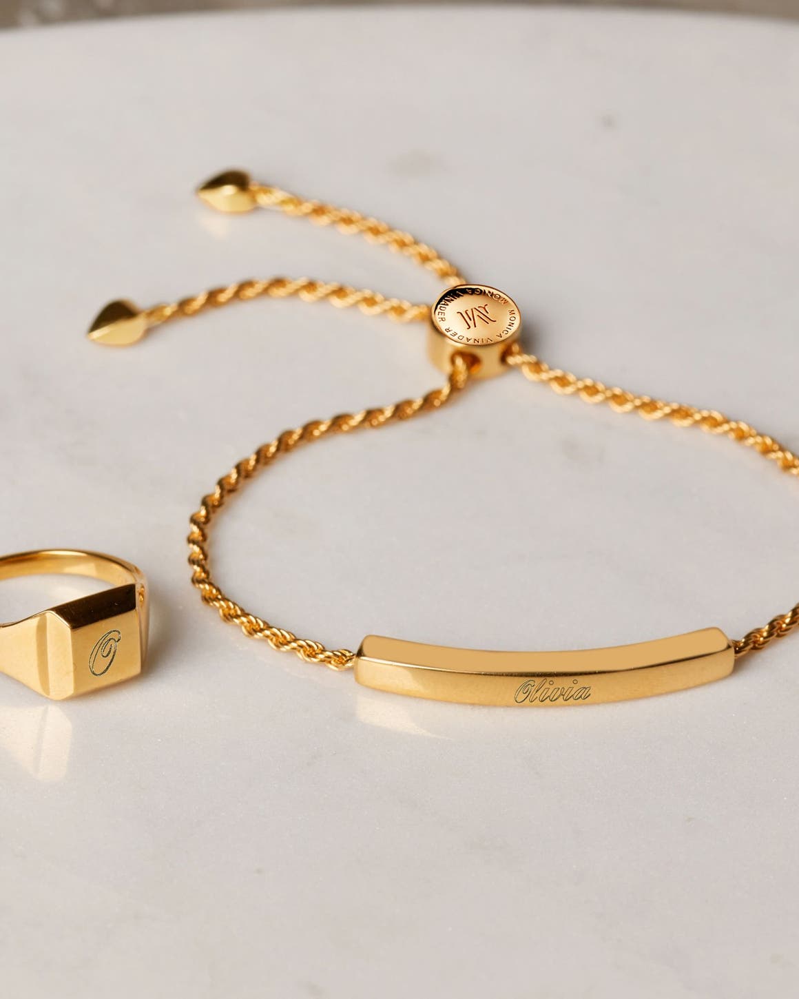 A gold ring and bracelet.