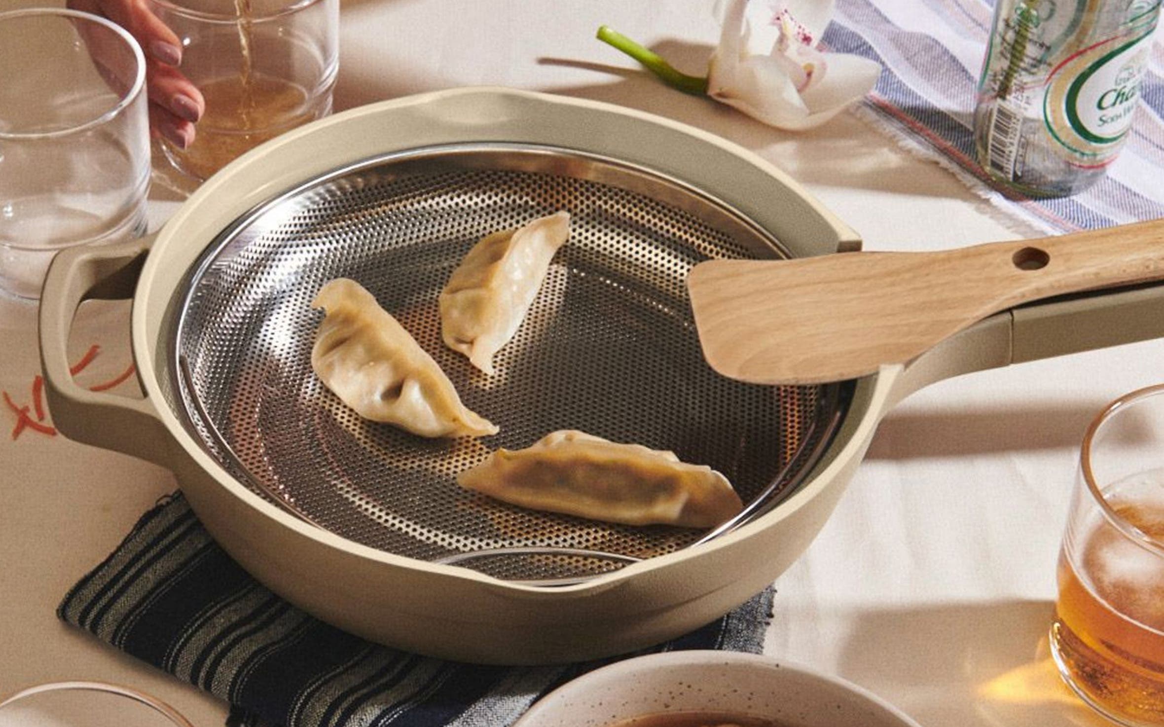 Potstickers cooking in an Our Place pan.