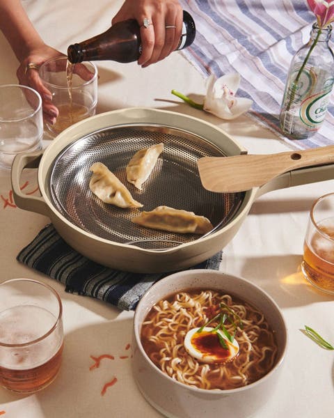 Potstickers cooking in an Our Place pan.